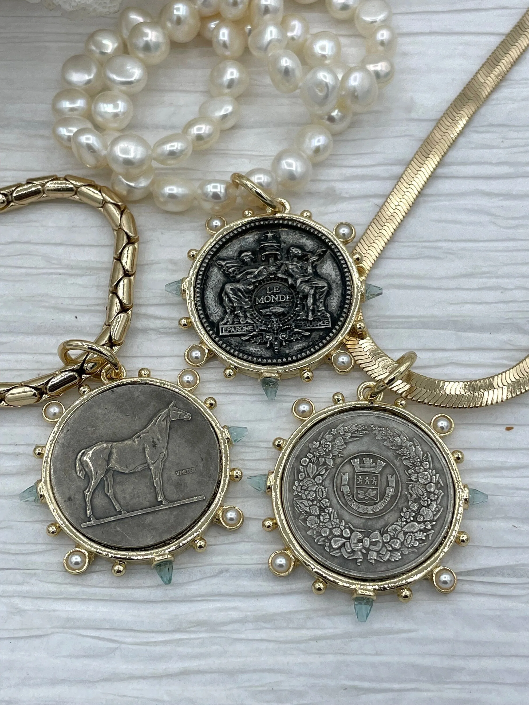 Optimized E-commerce Product Title: French Horticole De Dison Horse Coin Pendant with Bezel, Replicated Le Monde Coin, Aqua CZ and Pearl Accents